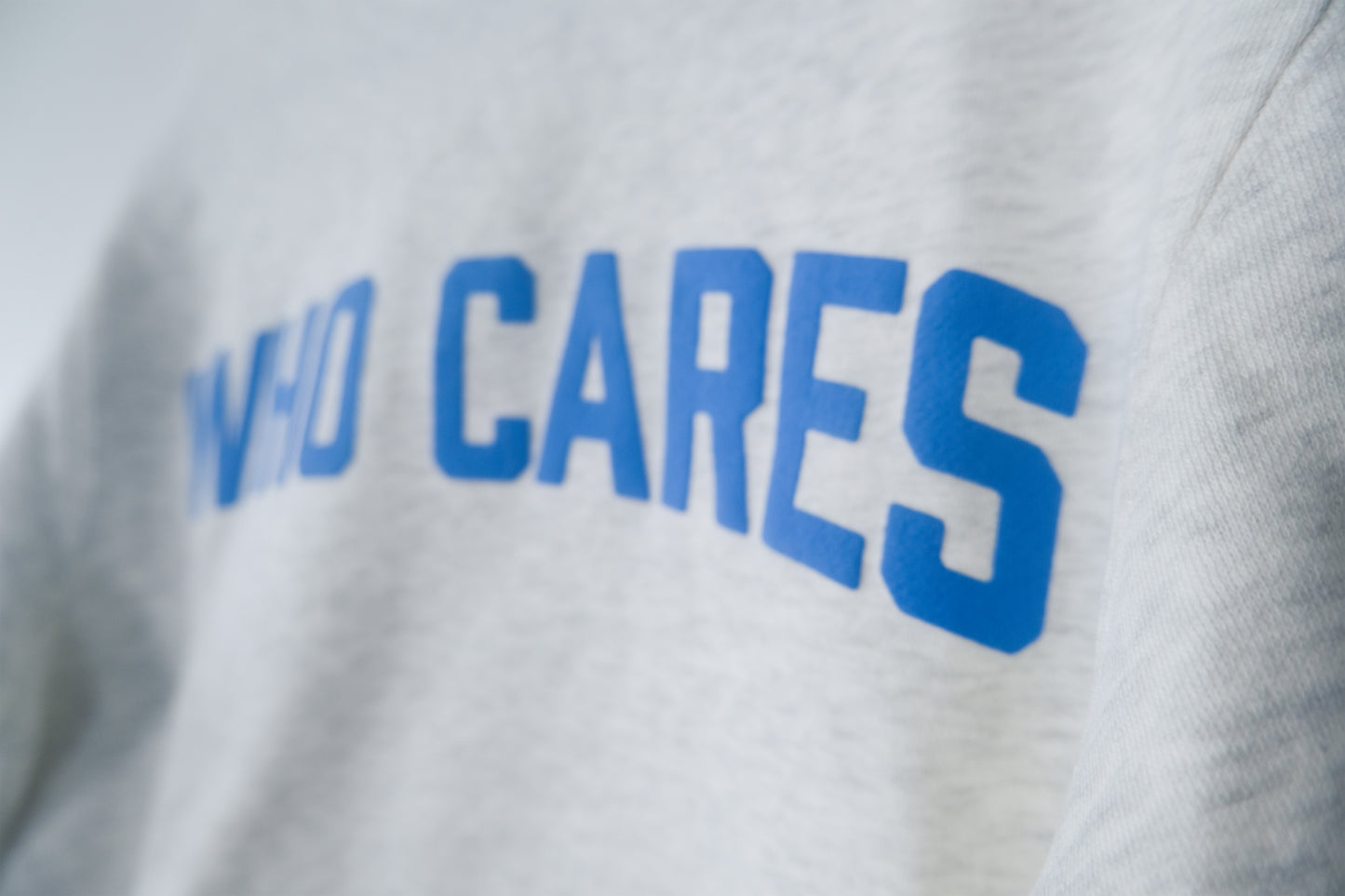 WHO CARES SMILEY CREWNECK