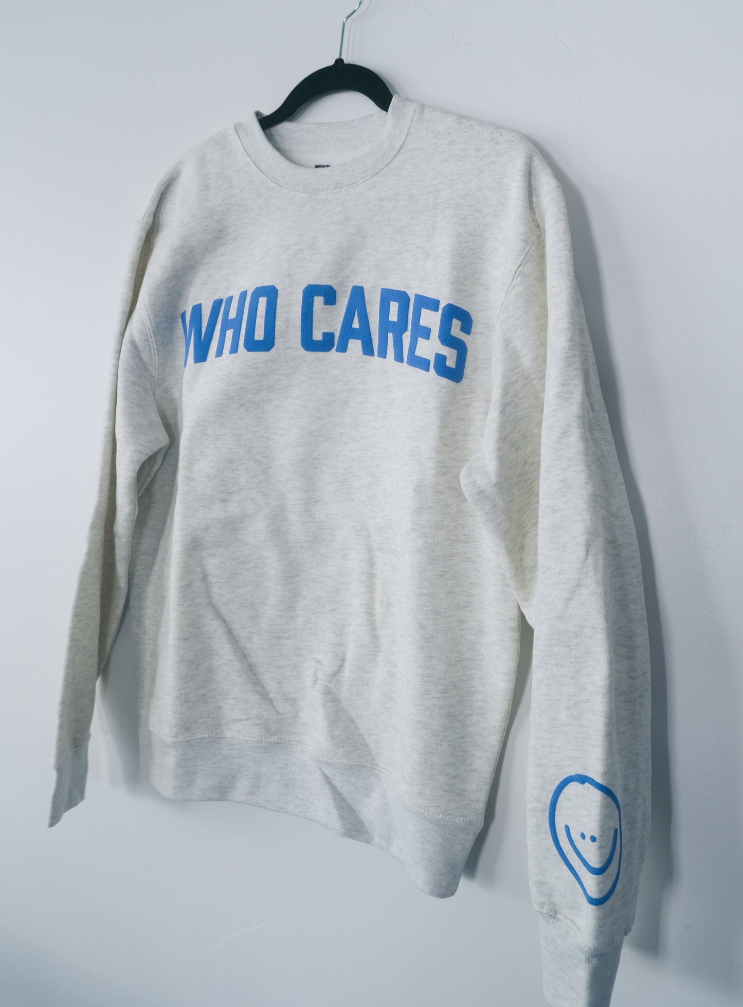 WHO CARES SMILEY CREWNECK